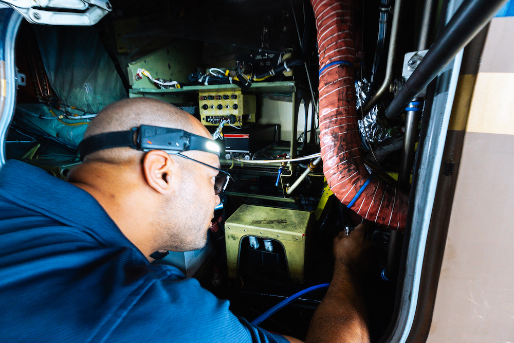 Battery Services JetRx mechanic performing a battery check on a private jet
