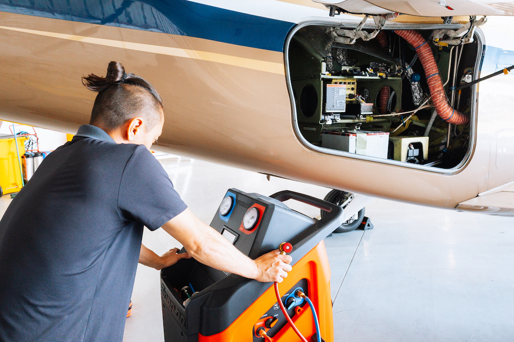 JetRx mechanic performing a comprehensive inspection on a private jet