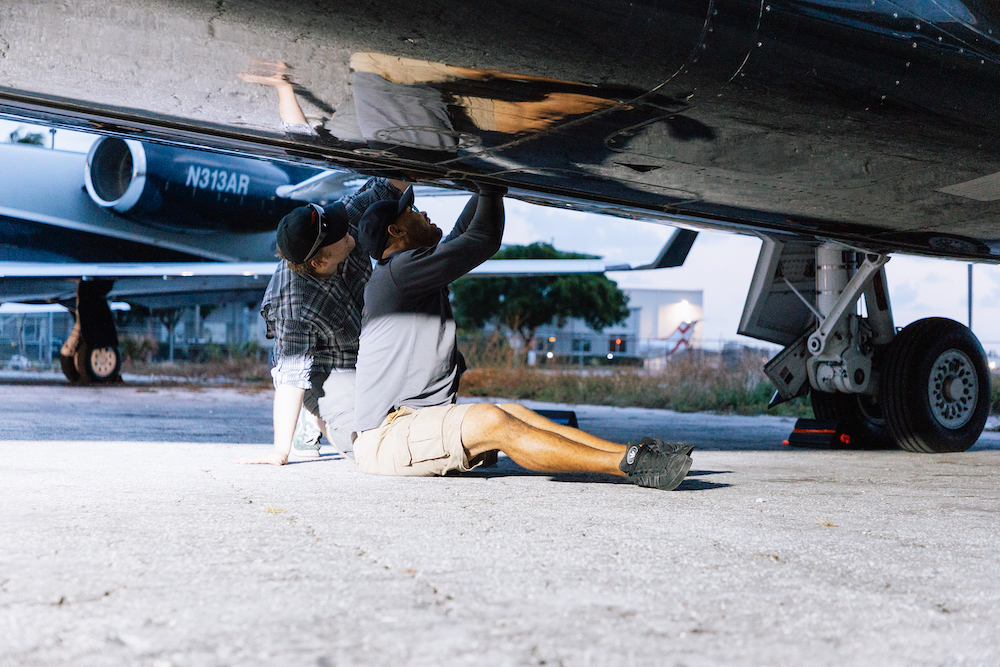 Scheduled Maintenance JetRx mechanics performing scheduled maintenance on a private jet